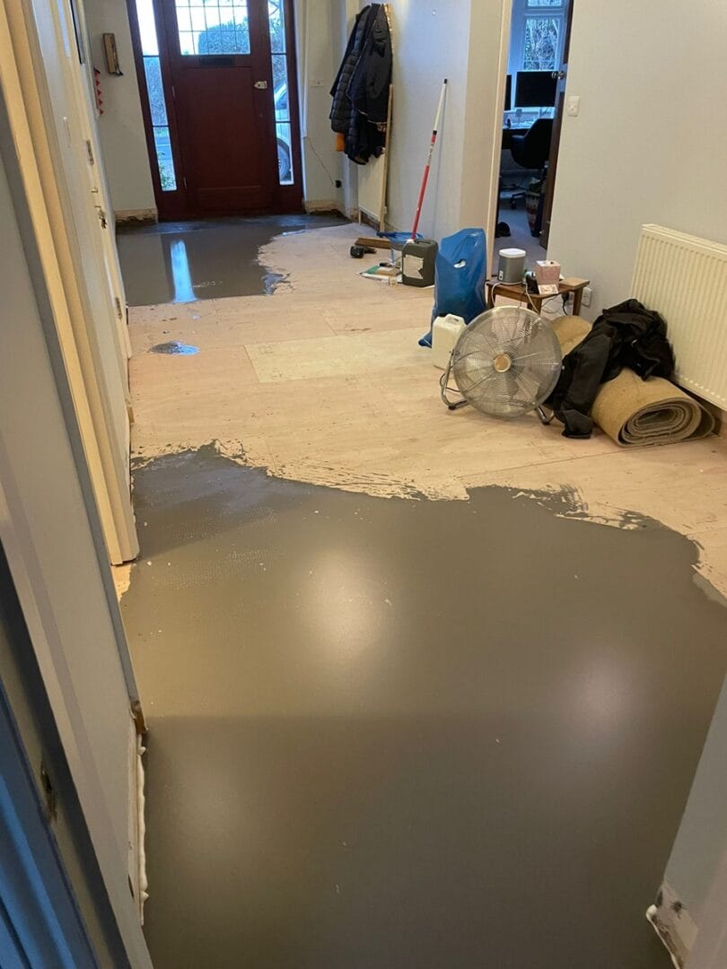 Hallway subfloor levelling compound during preparation before wood flooring