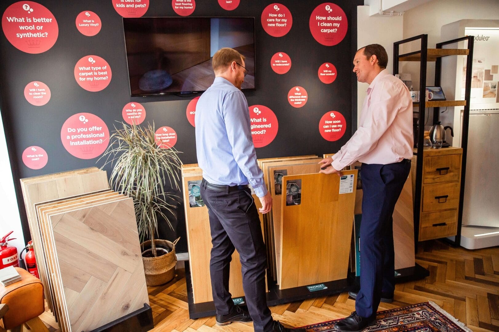 Wood flooring consultation with sample boards in Cambridge showroom