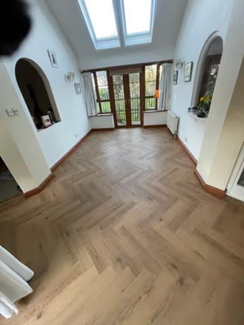 Full room view of engineered oak herringbone flooring in Cambridge