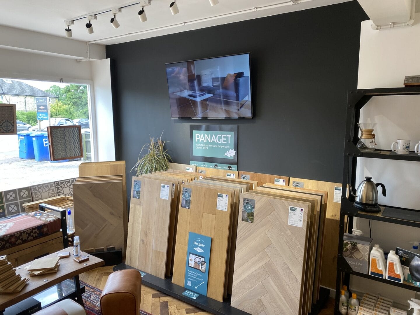 Engineered wood flooring showroom display with large plank and herringbone samples in Hertfordshire.