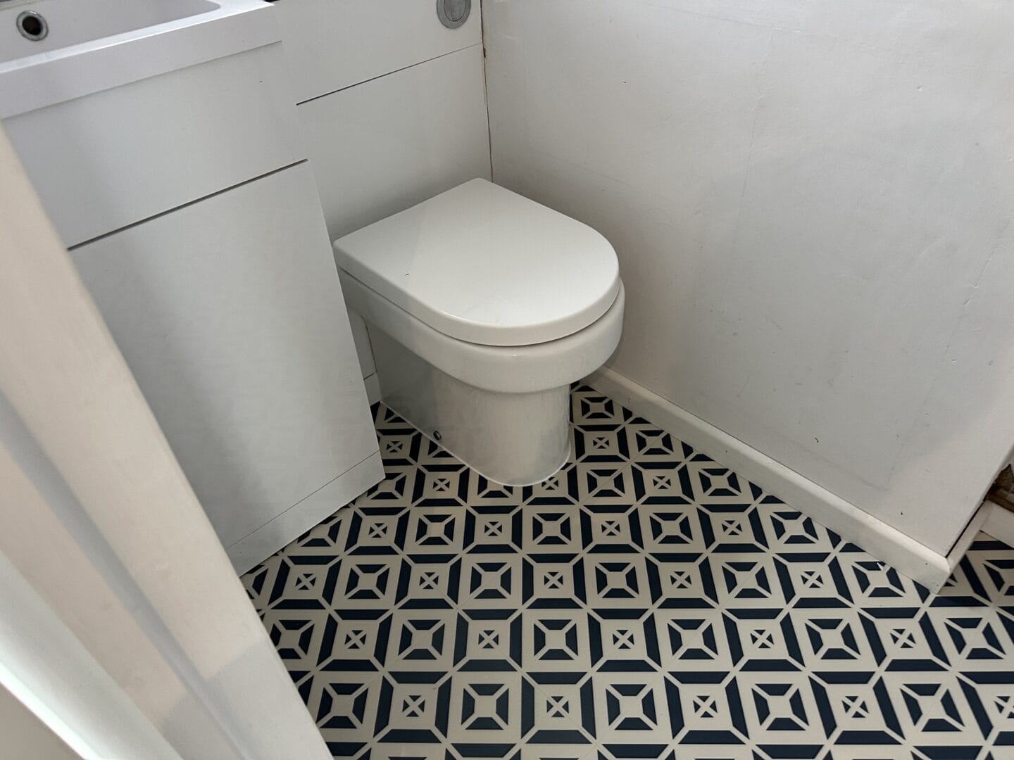 Harvey Maria Aubrey flooring fitted neatly around the toilet base in a Haslingfield cloakroom WC.
