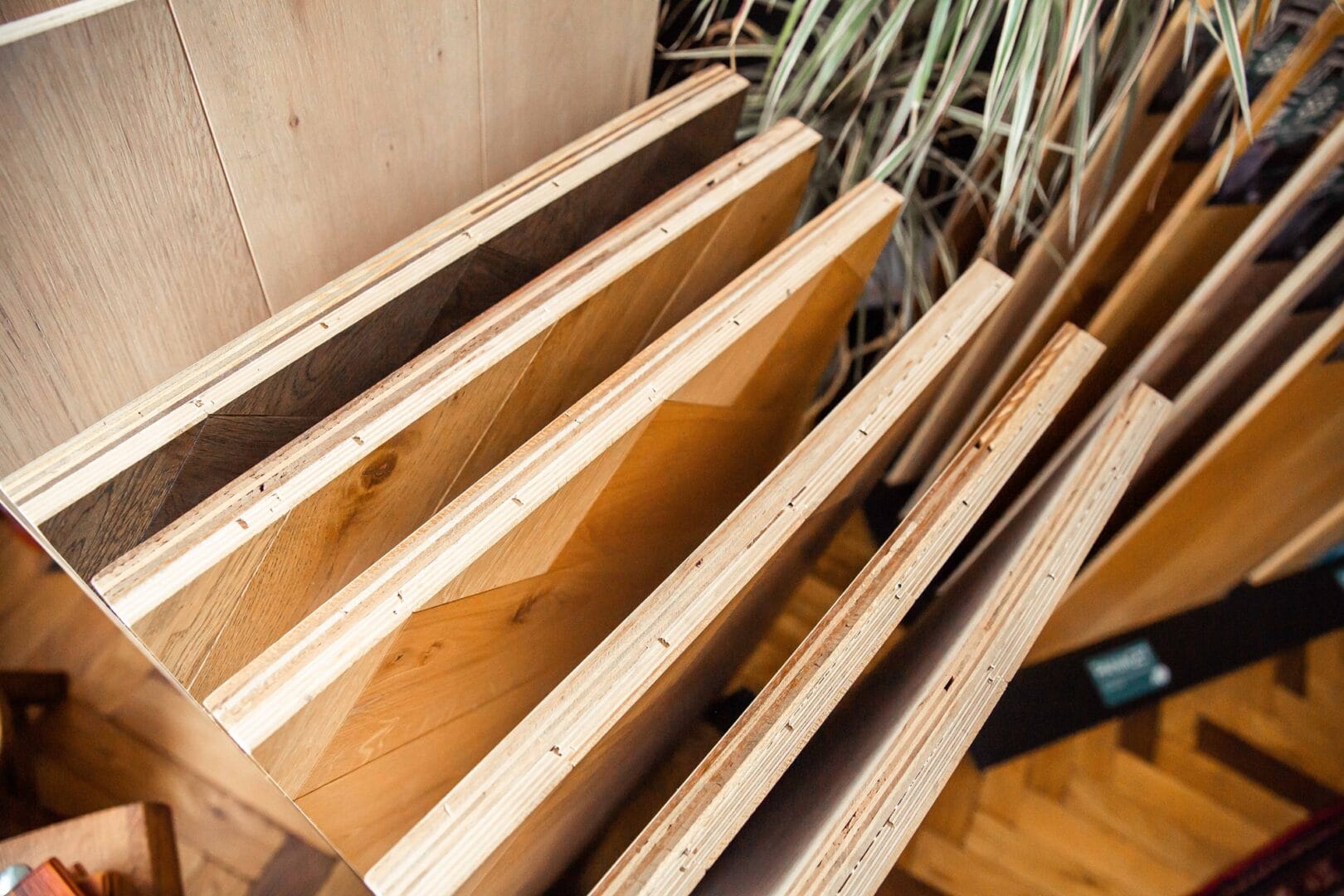 Herringbone engineered wood flooring samples displayed in a Hertfordshire showroom.