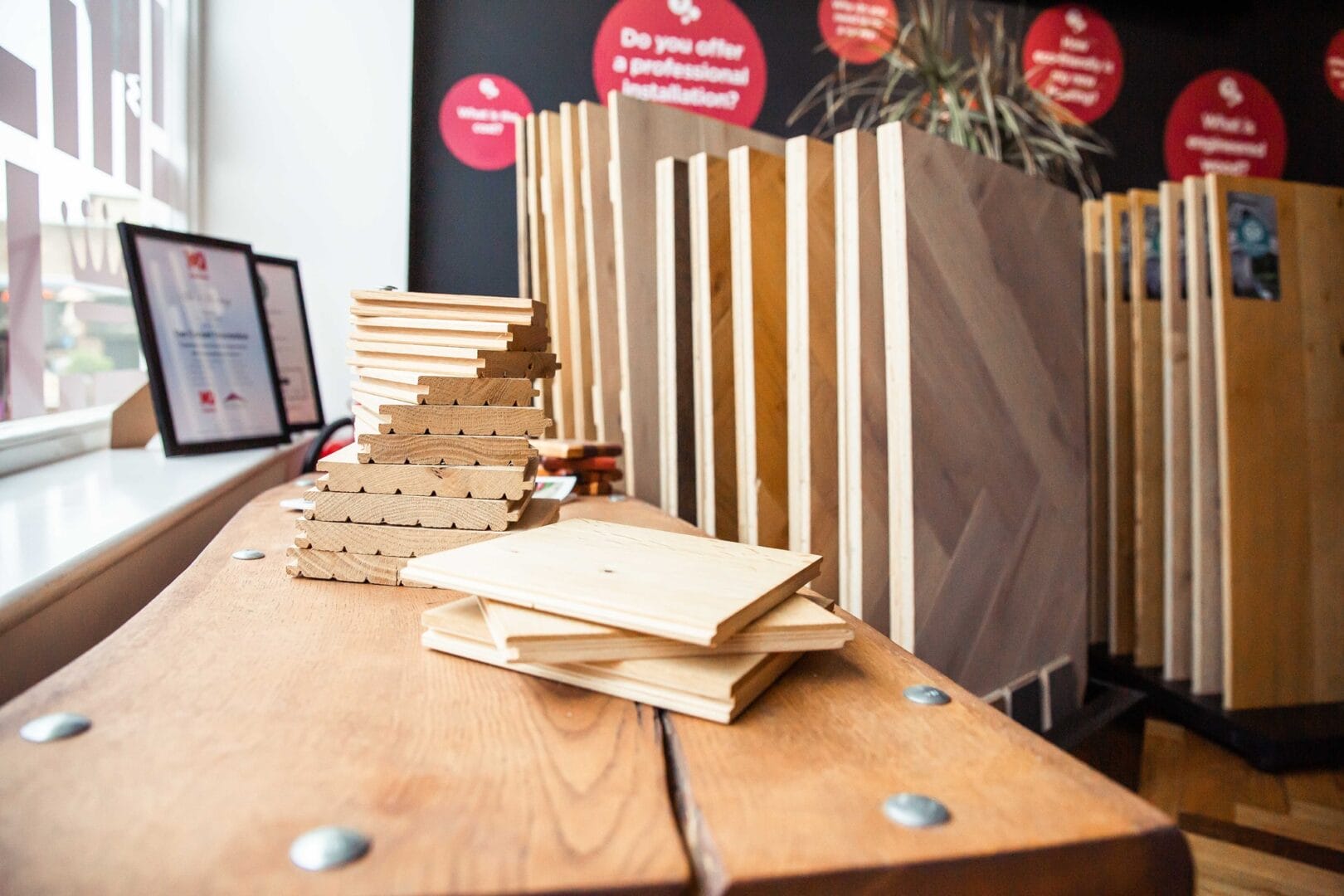 Oak flooring sample boards and herringbone displays inside the Art of Flooring showroom in Cambridge