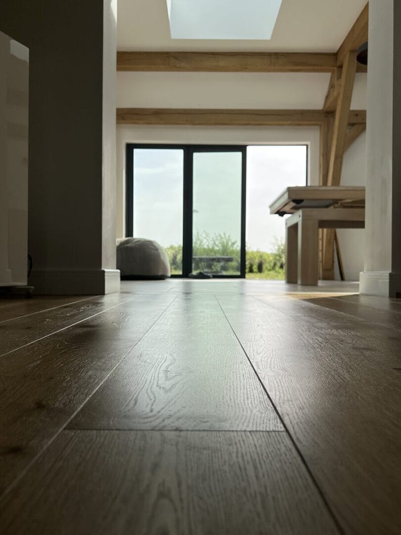 Oak floor finish in Cambridge open-plan room with large glass doors