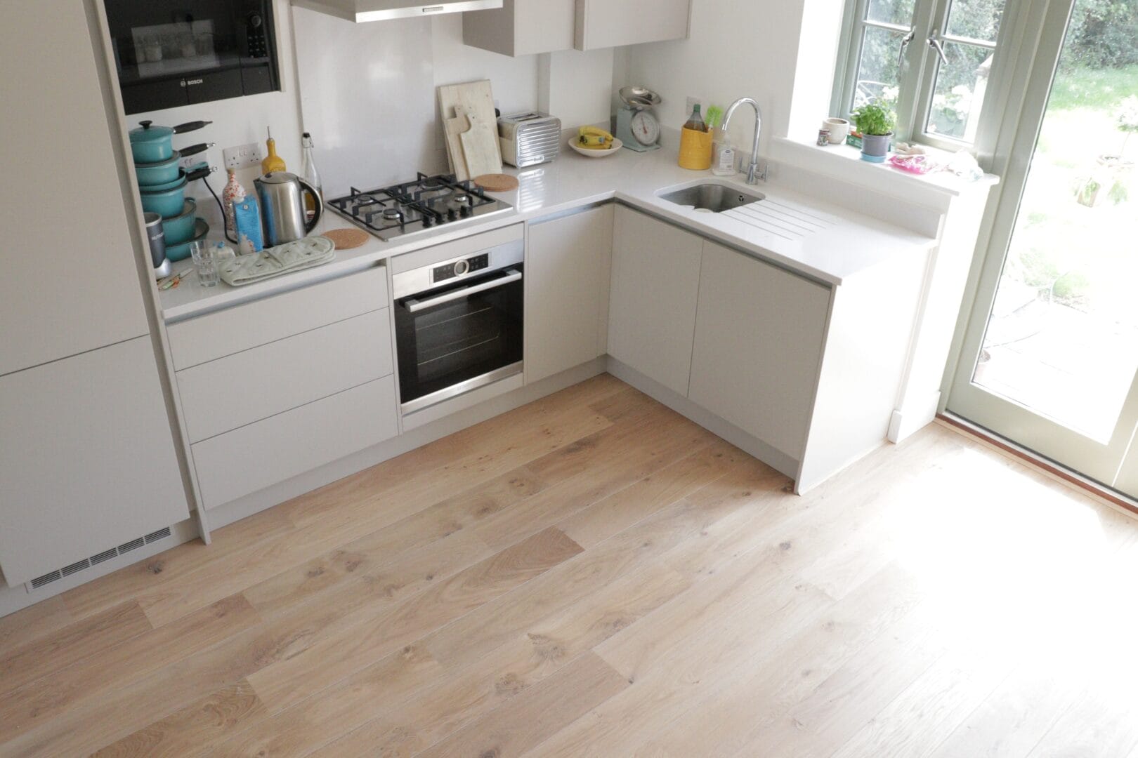 Maple engineered wood flooring installation in a modern Cambridge kitchen