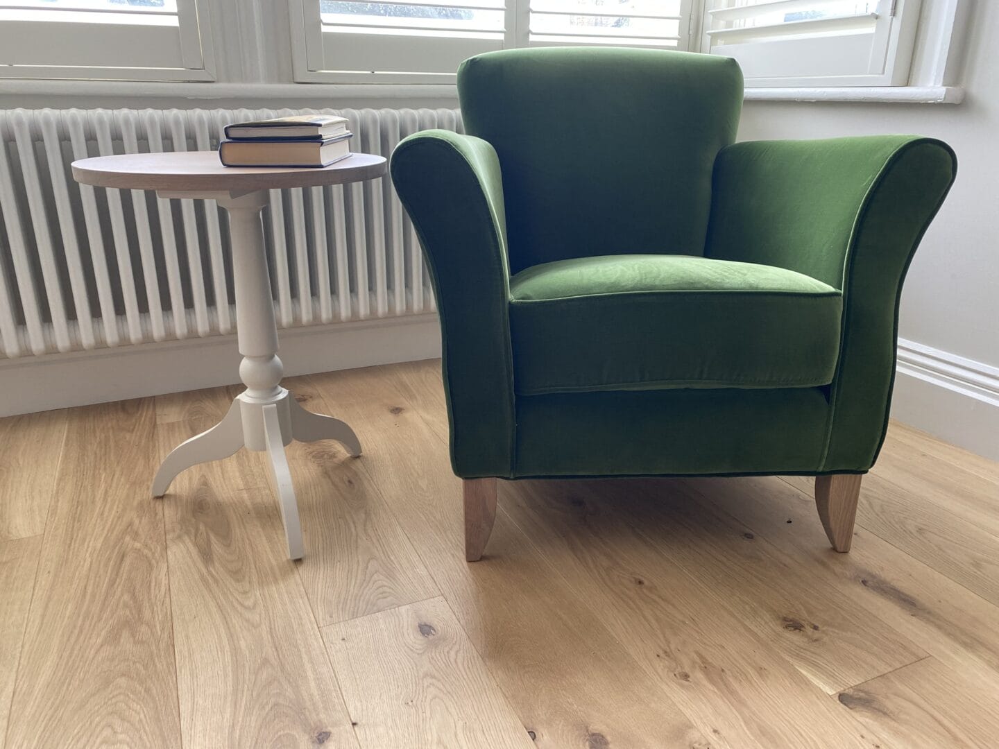 Maple engineered wood flooring with a green armchair in a Cambridge living area